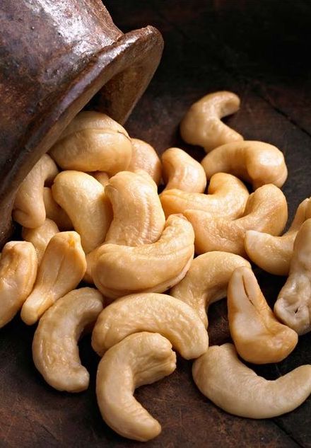 Side of walnut card tray with card groove and recessed card area.